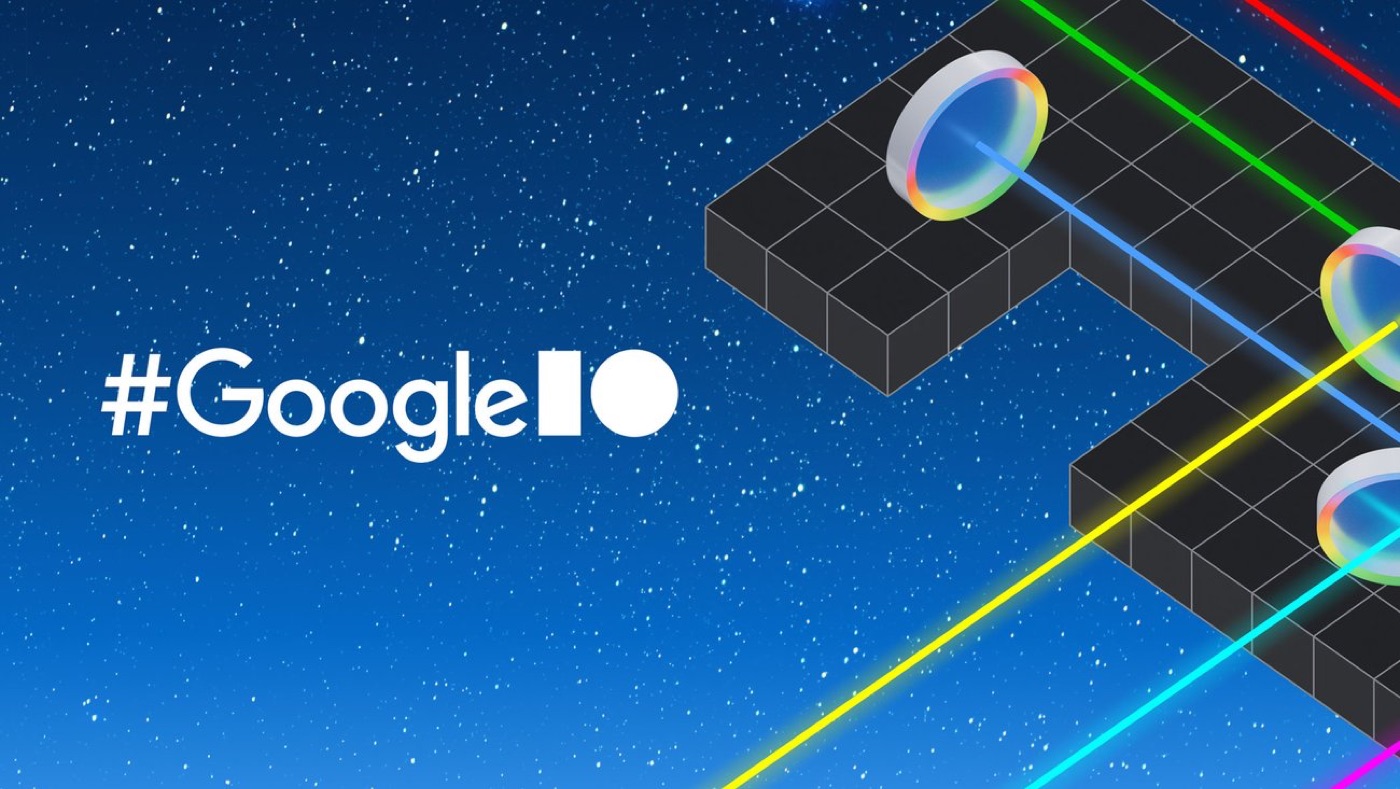 Google I/O key art: coloured light beams bouncing off lenses over an isometric grid.